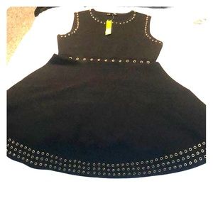 Black a line dress, gold eyelets